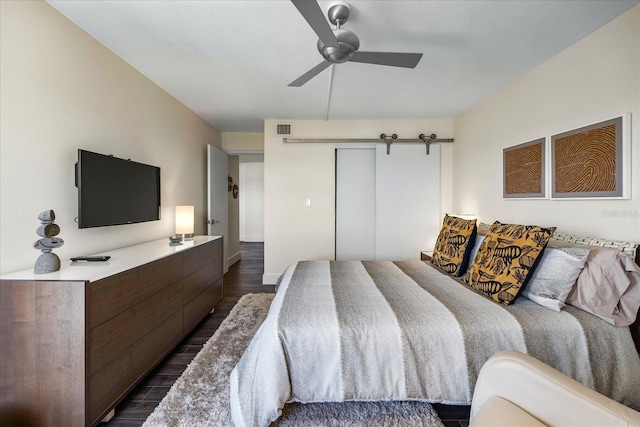 1651 Sand Key Estates Ct Unit 54, Clearwater Beach, FL 33767 - bedroom featuring dark wood-type flooring, a closet, and ceiling fan