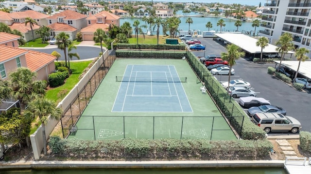 1651 Sand Key Estates Ct Unit 54, Clearwater Beach, FL 33767 - view of tennis court with a water view and shuffleboard