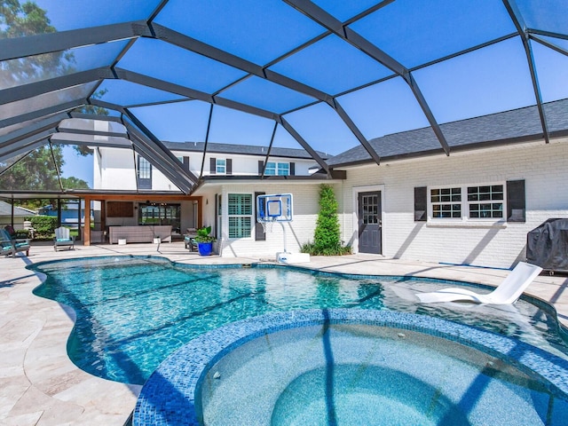 3724 Fawn Grove Ct, Land O Lakes, FL 34639 - view of pool featuring an outdoor hangout area, a pool with connected hot tub, a patio, and glass enclosure