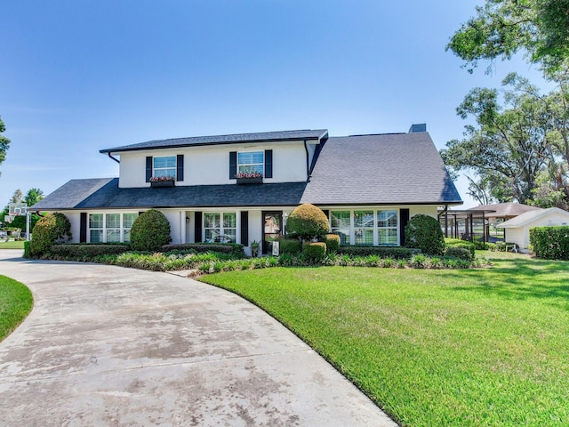 3724 Fawn Grove Ct, Land O Lakes, FL 34639 - traditional-style house featuring a front lawn, concrete driveway, and roof with shingles