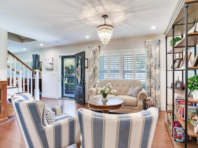 3724 Fawn Grove Ct, Land O Lakes, FL 34639 - living room featuring a chandelier, wood finished floors, stairs, and recessed lighting