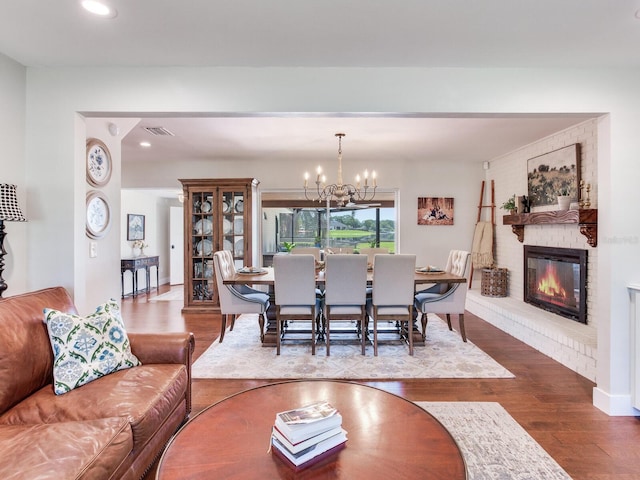 3724 Fawn Grove Ct, Land O Lakes, FL 34639 - living area featuring wood finished floors, a fireplace, a chandelier, and recessed lighting