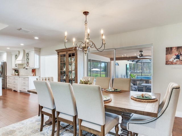 3724 Fawn Grove Ct, Land O Lakes, FL 34639 - dining area with a chandelier, wood finished floors, and recessed lighting