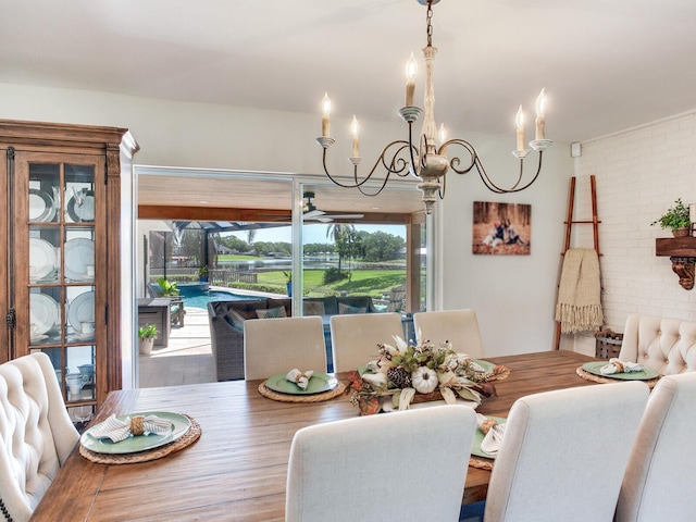 3724 Fawn Grove Ct, Land O Lakes, FL 34639 - dining area with a chandelier, a ceiling fan, and wood finished floors