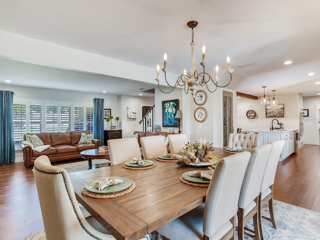 3724 Fawn Grove Ct, Land O Lakes, FL 34639 - dining room featuring wood finished floors, a chandelier, recessed lighting, and stairs