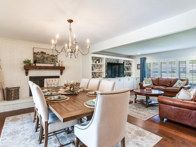 3724 Fawn Grove Ct, Land O Lakes, FL 34639 - dining area with wood finished floors, a chandelier, and brick wall