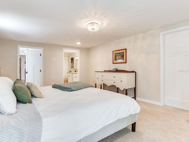 3724 Fawn Grove Ct, Land O Lakes, FL 34639 - bedroom featuring light carpet, ensuite bath, baseboards, and recessed lighting