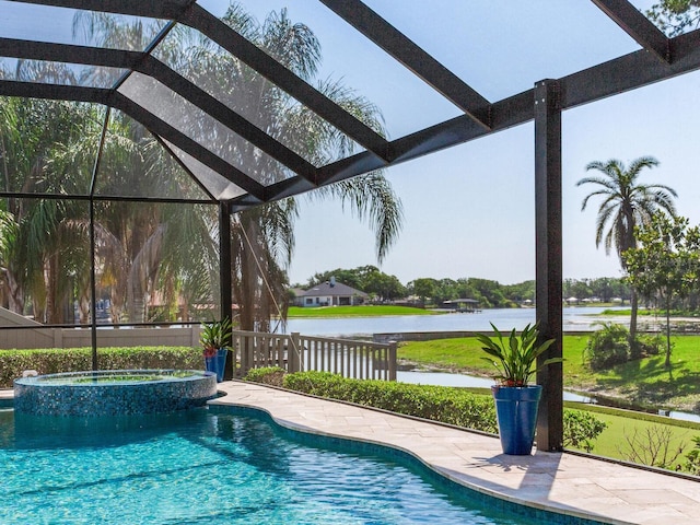 3724 Fawn Grove Ct, Land O Lakes, FL 34639 - view of swimming pool featuring a water view, glass enclosure, and a pool with connected hot tub