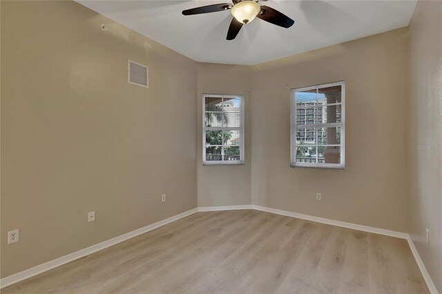 530 S Gulfview Blvd Unit 203, Clearwater Beach, FL 33767 - empty room with ceiling fan, light wood finished floors, and baseboards