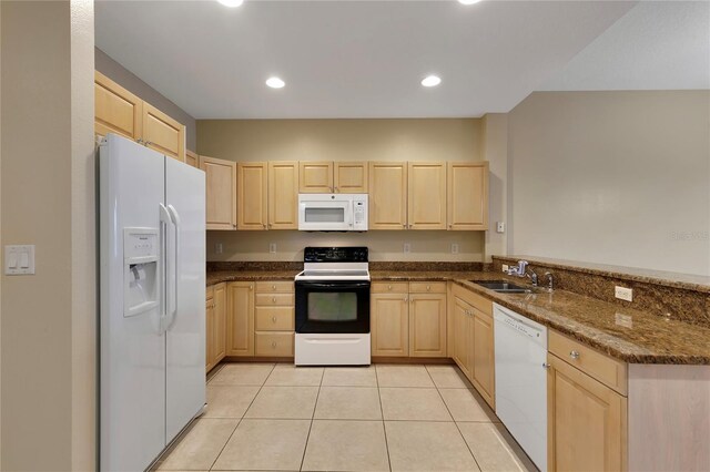 530 S Gulfview Blvd Unit 203, Clearwater Beach, FL 33767 - kitchen featuring white appliances, light brown cabinetry, a sink, a peninsula, and light tile patterned flooring