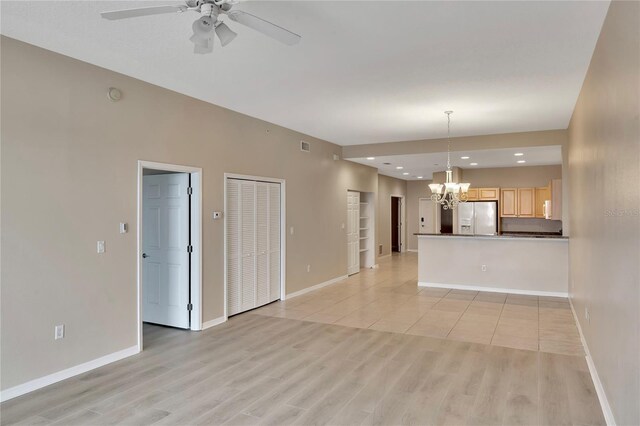 530 S Gulfview Blvd Unit 203, Clearwater Beach, FL 33767 - unfurnished living room with a chandelier, baseboards, ceiling fan, light wood-type flooring, and recessed lighting
