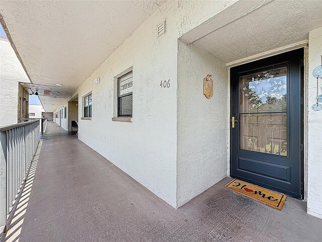 5920 80th St N Unit 406, Saint Petersburg, FL 33709 - view of exterior entry with stucco siding