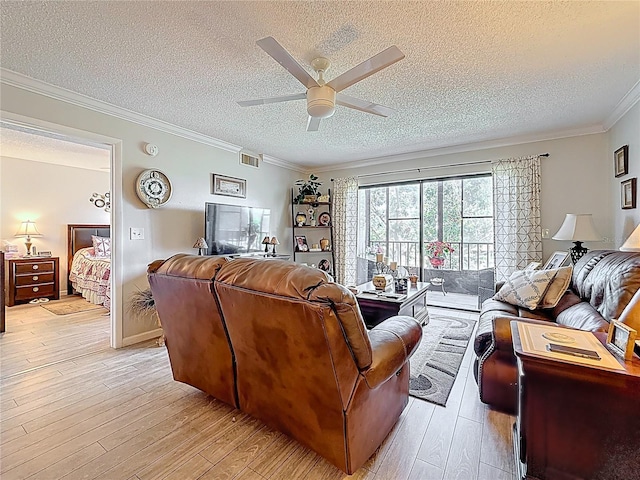 5920 80th St N Unit 406, Saint Petersburg, FL 33709 - living room featuring a textured ceiling, ceiling fan, light wood-style floors, and crown molding
