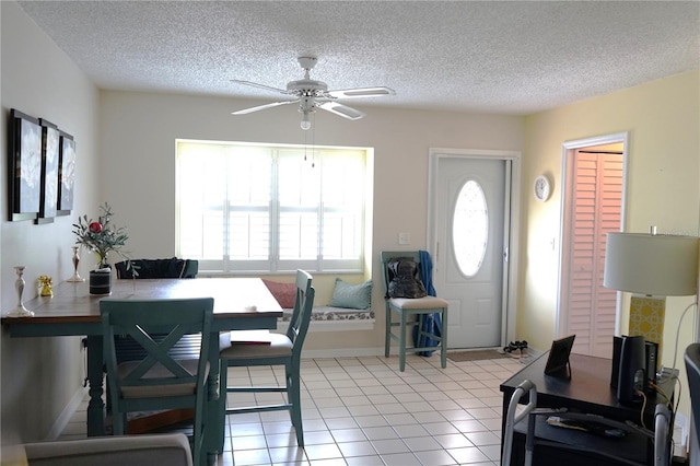 413 Lake Point Ct Unit 4B, Sun City Center, FL 33573 - dining area featuring ceiling fan, plenty of natural light, a textured ceiling, light tile patterned flooring, and baseboards