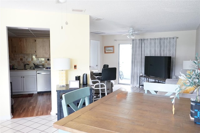 413 Lake Point Ct Unit 4B, Sun City Center, FL 33573 - dining area featuring ceiling fan and light tile patterned floors