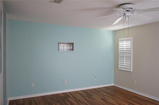 413 Lake Point Ct Unit 4B, Sun City Center, FL 33573 - unfurnished room with dark wood-style flooring, a ceiling fan, a textured ceiling, and baseboards