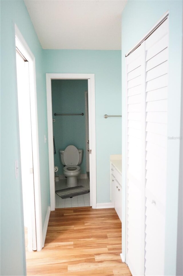413 Lake Point Ct Unit 4B, Sun City Center, FL 33573 - hall featuring light wood-type flooring and baseboards