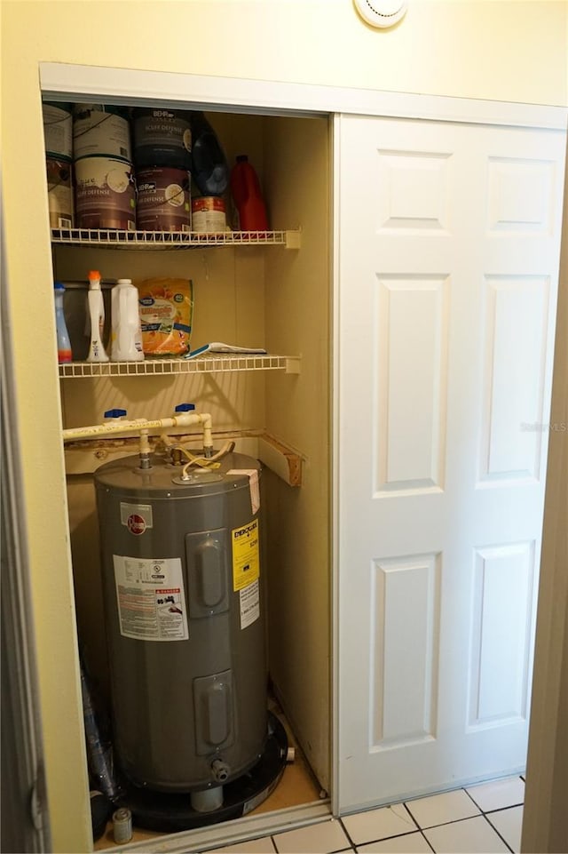 413 Lake Point Ct Unit 4B, Sun City Center, FL 33573 - utility room featuring electric water heater