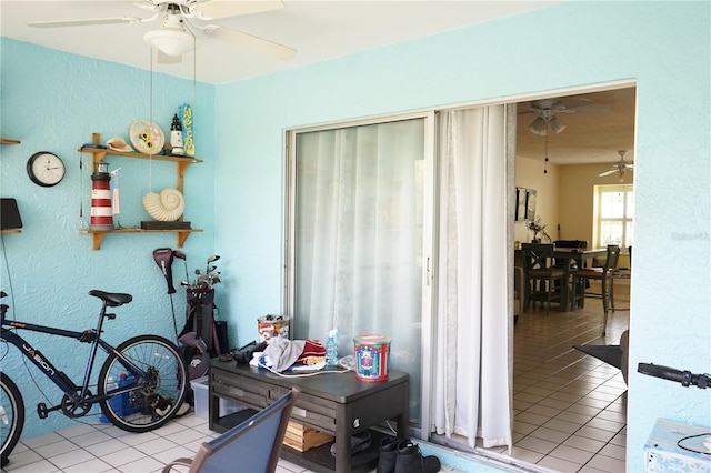 413 Lake Point Ct Unit 4B, Sun City Center, FL 33573 - home office with ceiling fan, a textured wall, and tile patterned flooring