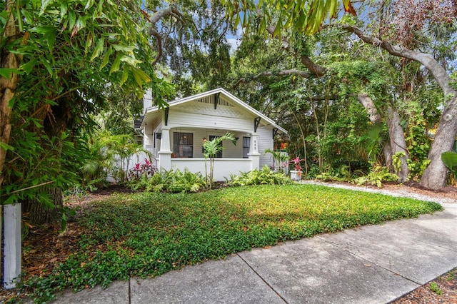 848 9th Ave S, Saint Petersburg, FL 33701 - bungalow-style house with a chimney and covered porch