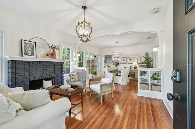 848 9th Ave S, Saint Petersburg, FL 33701 - living room with a chandelier, hardwood / wood-style flooring, and ornate columns