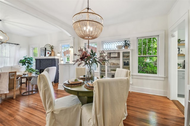 848 9th Ave S, Saint Petersburg, FL 33701 - dining area with a chandelier, wood-type flooring, healthy amount of natural light, and baseboards