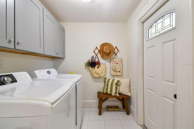 848 9th Ave S, Saint Petersburg, FL 33701 - laundry room featuring independent washer and dryer, cabinet space, baseboards, and light tile patterned floors