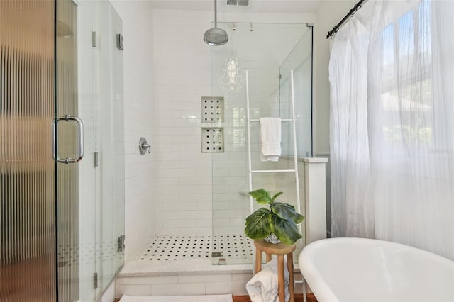 848 9th Ave S, Saint Petersburg, FL 33701 - bathroom featuring a stall shower and a freestanding tub