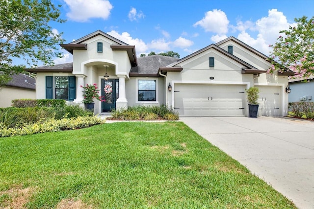 679 Challice Dr, Spring Hill, FL 34609 - view of front of home with stucco siding, an attached garage, driveway, and a front lawn