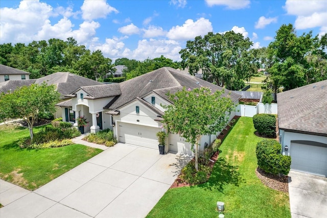 679 Challice Dr, Spring Hill, FL 34609 - view of front of house featuring stucco siding, an attached garage, driveway, and a shingled roof