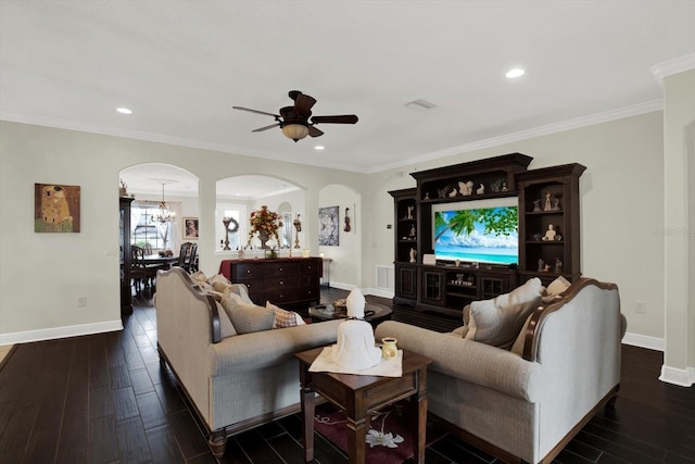 679 Challice Dr, Spring Hill, FL 34609 - living room with arched walkways, baseboards, dark wood-style flooring, a chandelier, and ceiling fan
