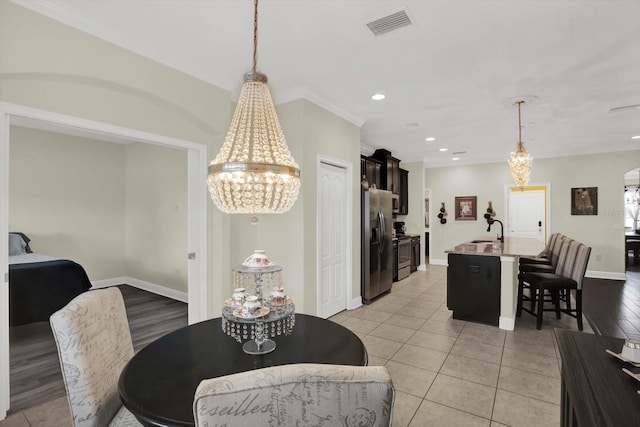 679 Challice Dr, Spring Hill, FL 34609 - dining room with a chandelier, recessed lighting, baseboards, and light tile patterned floors