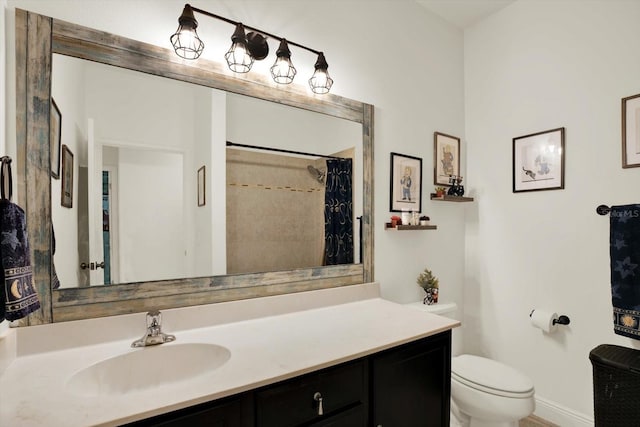 679 Challice Dr, Spring Hill, FL 34609 - full bath featuring toilet, vanity, curtained shower, and baseboards