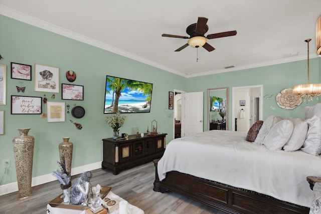 679 Challice Dr, Spring Hill, FL 34609 - bedroom with light wood-style flooring, ornamental molding, a chandelier, baseboards, and ceiling fan