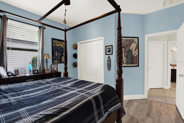 679 Challice Dr, Spring Hill, FL 34609 - bedroom with a closet, wood finished floors, baseboards, and ceiling fan