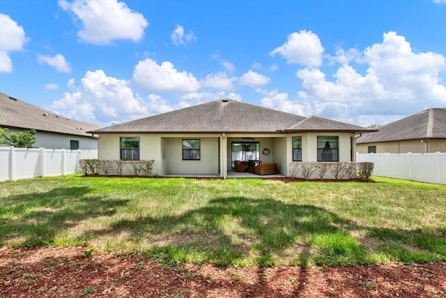 679 Challice Dr, Spring Hill, FL 34609 - back of house featuring stucco siding, an outdoor living space, a patio, and a shingled roof