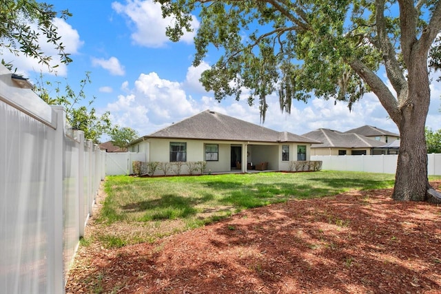 679 Challice Dr, Spring Hill, FL 34609 - rear view of house with stucco siding