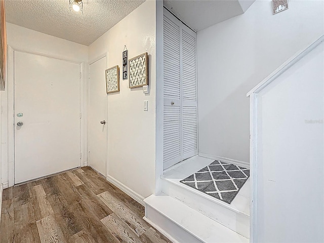 147 114th Ave NE Unit 147, Saint Petersburg, FL 33716 - entryway featuring wood finished floors and a textured ceiling