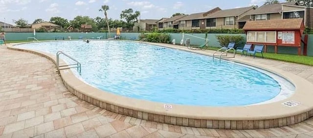 147 114th Ave NE Unit 147, Saint Petersburg, FL 33716 - community pool featuring a residential view and a patio area