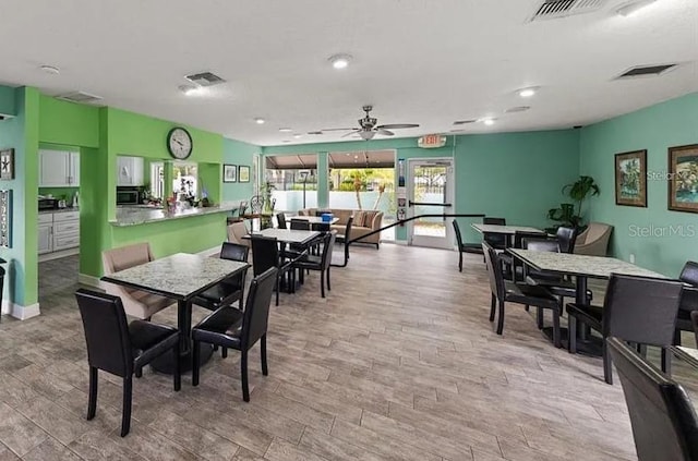 147 114th Ave NE Unit 147, Saint Petersburg, FL 33716 - dining space with ceiling fan and wood finished floors