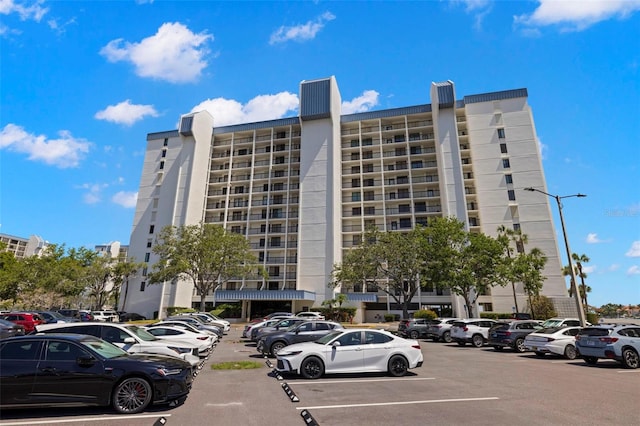 9425 Blind Pass Rd Unit 1008, St Pete Beach, FL 33706 - view of apartment building / complex featuring uncovered parking