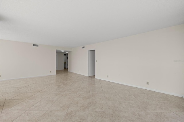 9425 Blind Pass Rd Unit 1008, St Pete Beach, FL 33706 - spare room featuring baseboards