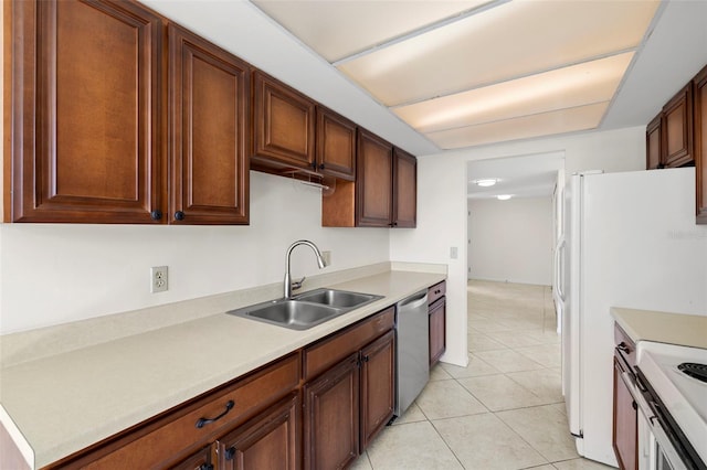 9425 Blind Pass Rd Unit 1008, St Pete Beach, FL 33706 - kitchen featuring a sink, stainless steel dishwasher, light countertops, light tile patterned flooring, and stove