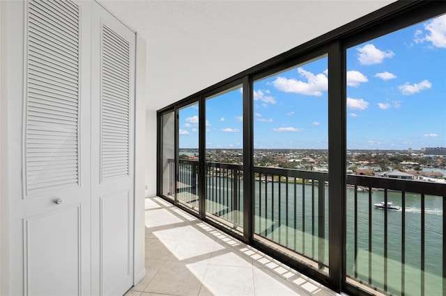 9425 Blind Pass Rd Unit 1008, St Pete Beach, FL 33706 - unfurnished sunroom featuring a water view