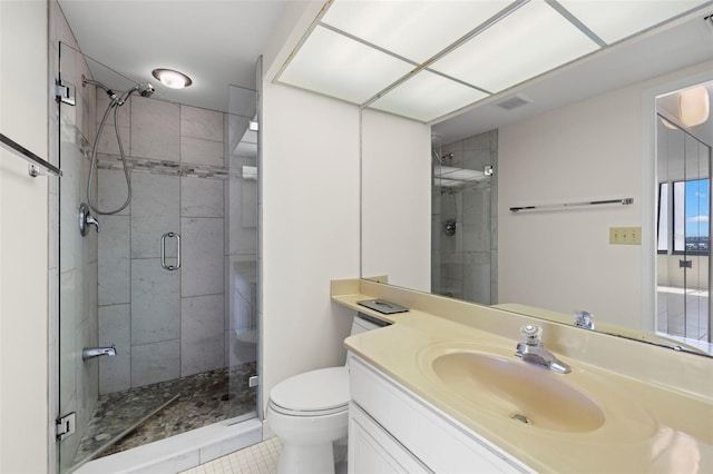 9425 Blind Pass Rd Unit 1008, St Pete Beach, FL 33706 - bathroom featuring toilet, a stall shower, vanity, and tile patterned flooring