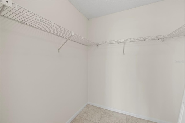 9425 Blind Pass Rd Unit 1008, St Pete Beach, FL 33706 - spacious closet with light tile patterned flooring