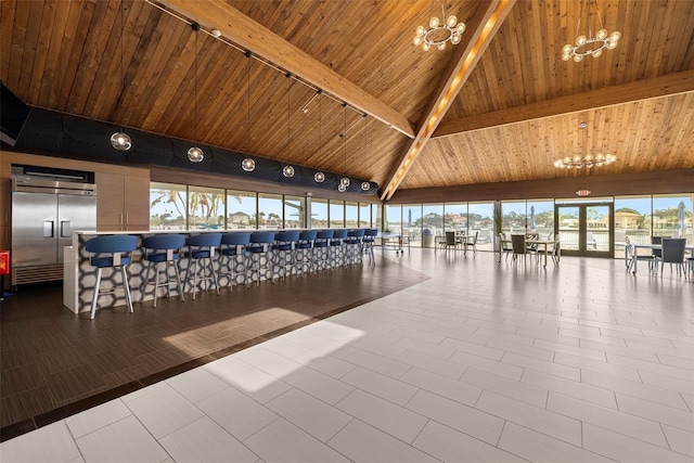 9425 Blind Pass Rd Unit 1008, St Pete Beach, FL 33706 - lobby featuring wood ceiling with exposed beams and high vaulted ceiling