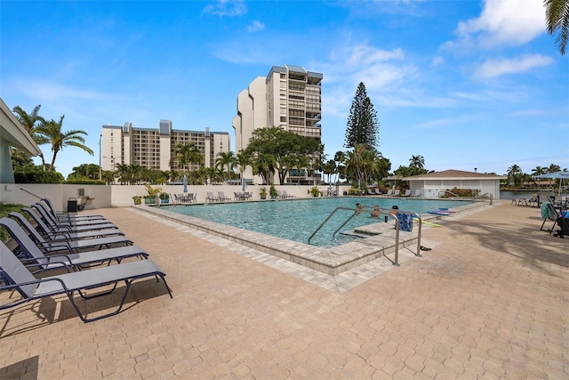 9425 Blind Pass Rd Unit 1008, St Pete Beach, FL 33706 - community pool featuring a patio area