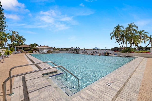 9425 Blind Pass Rd Unit 1008, St Pete Beach, FL 33706 - community pool featuring a patio area
