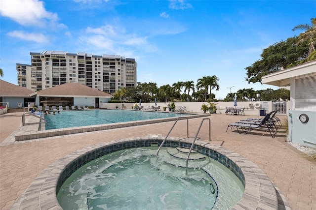 9425 Blind Pass Rd Unit 1008, St Pete Beach, FL 33706 - community pool with a hot tub and a patio